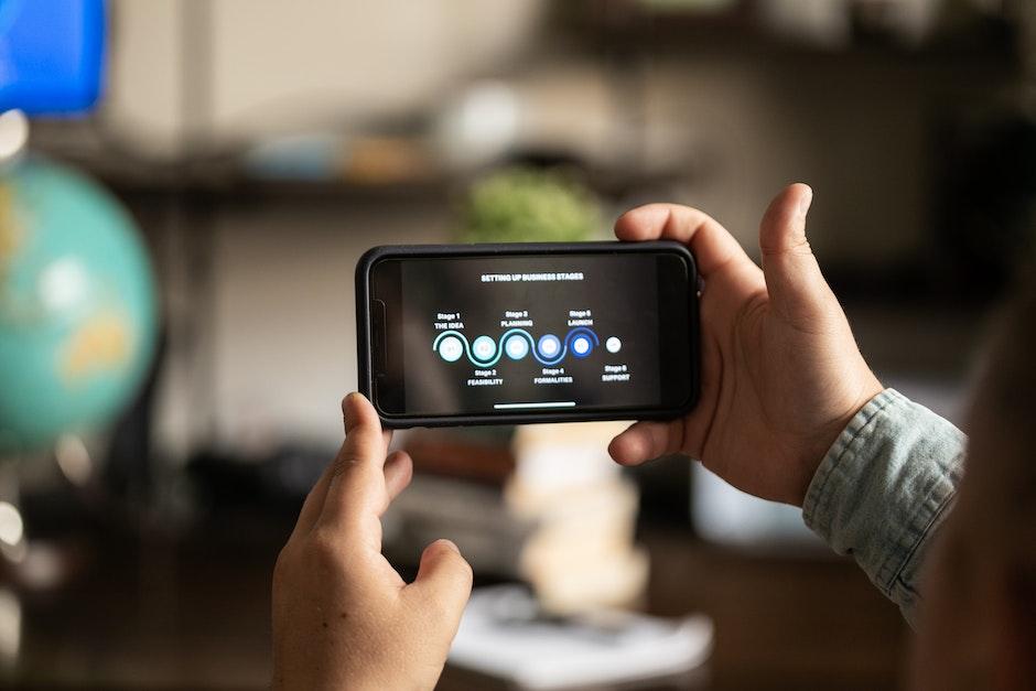 Close-Up Shot of a Person Holding a Smartphone